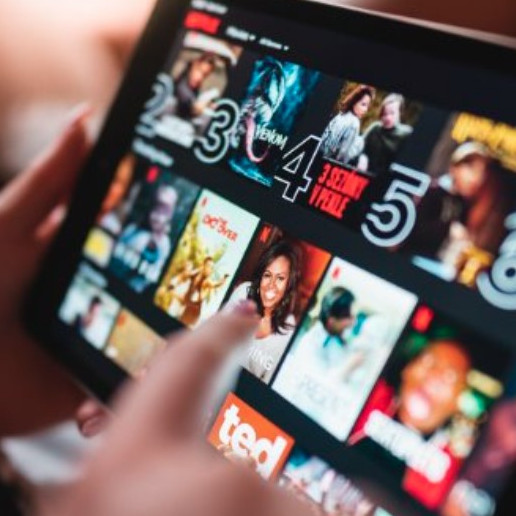 A tablet screen showing video recommendations from a streaming website